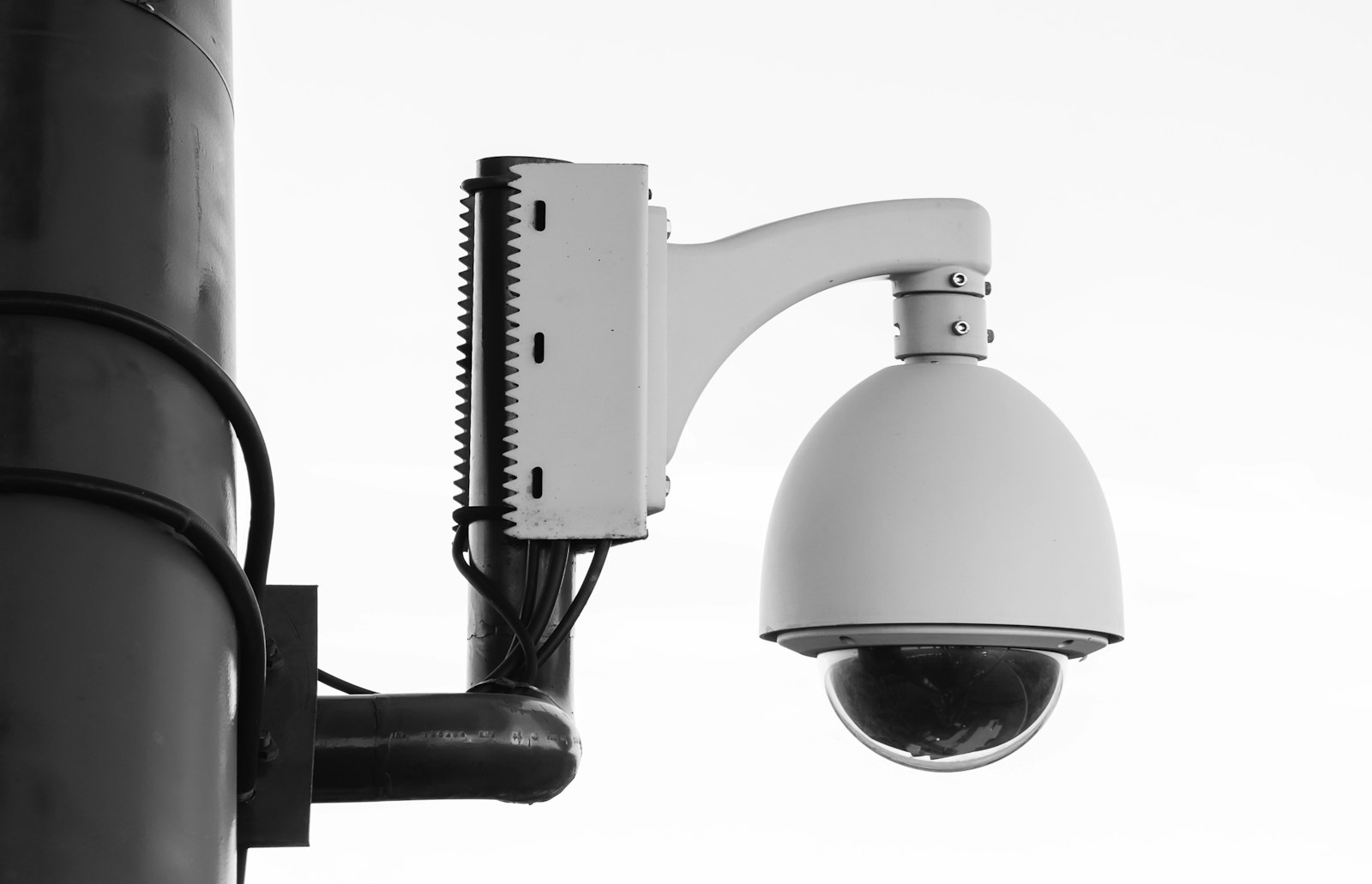 Smart pole with sensors and cameras above a city street