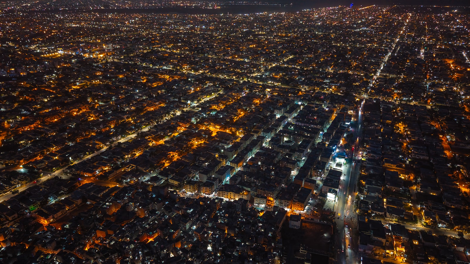 City lights at night forming dense clusters seen from above
